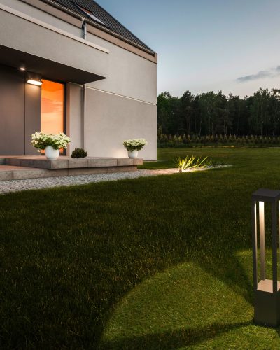 Image of modern house with big garden and decorative outdoor lighting